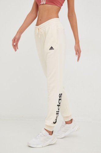 Adidas pantaloni de trening femei, culoarea bej, cu imprimeu